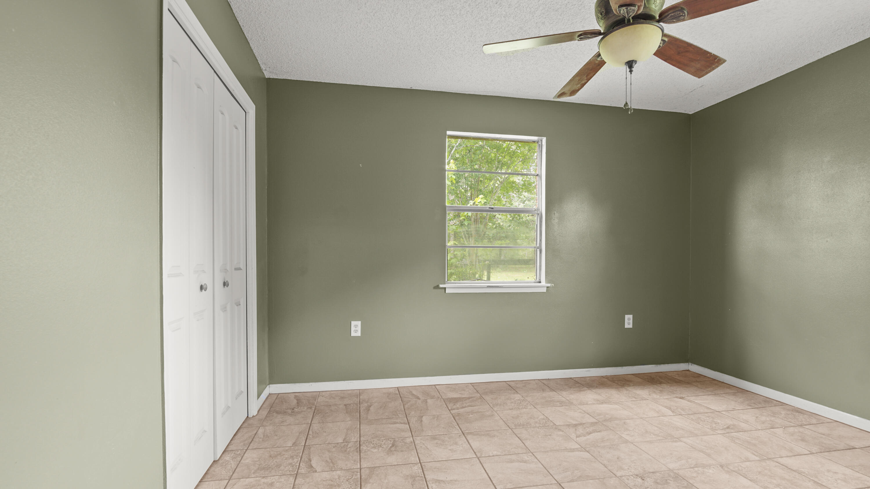 270 Windham Way DeFuniak Springs, FL 32433 - Photo 27 of 51 an empty room with windows and fan