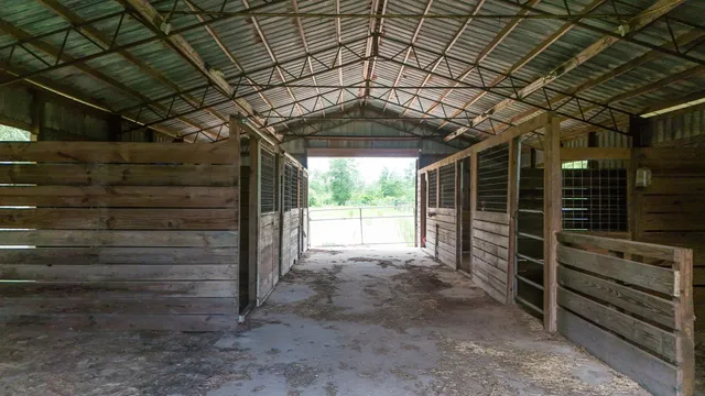 a view of small space with wooden fence