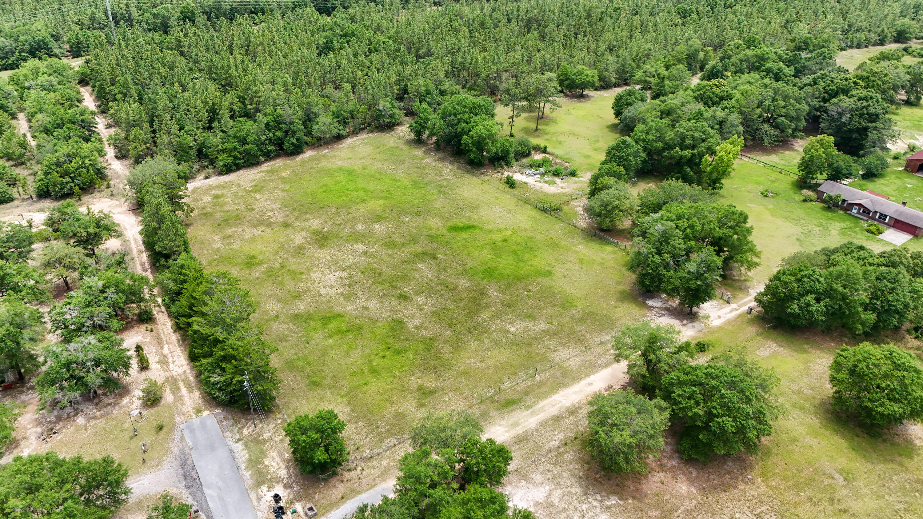 270 Windham Way DeFuniak Springs, FL 32433 - Photo 47 of 51 an aerial view of residential house with pool and trees all around