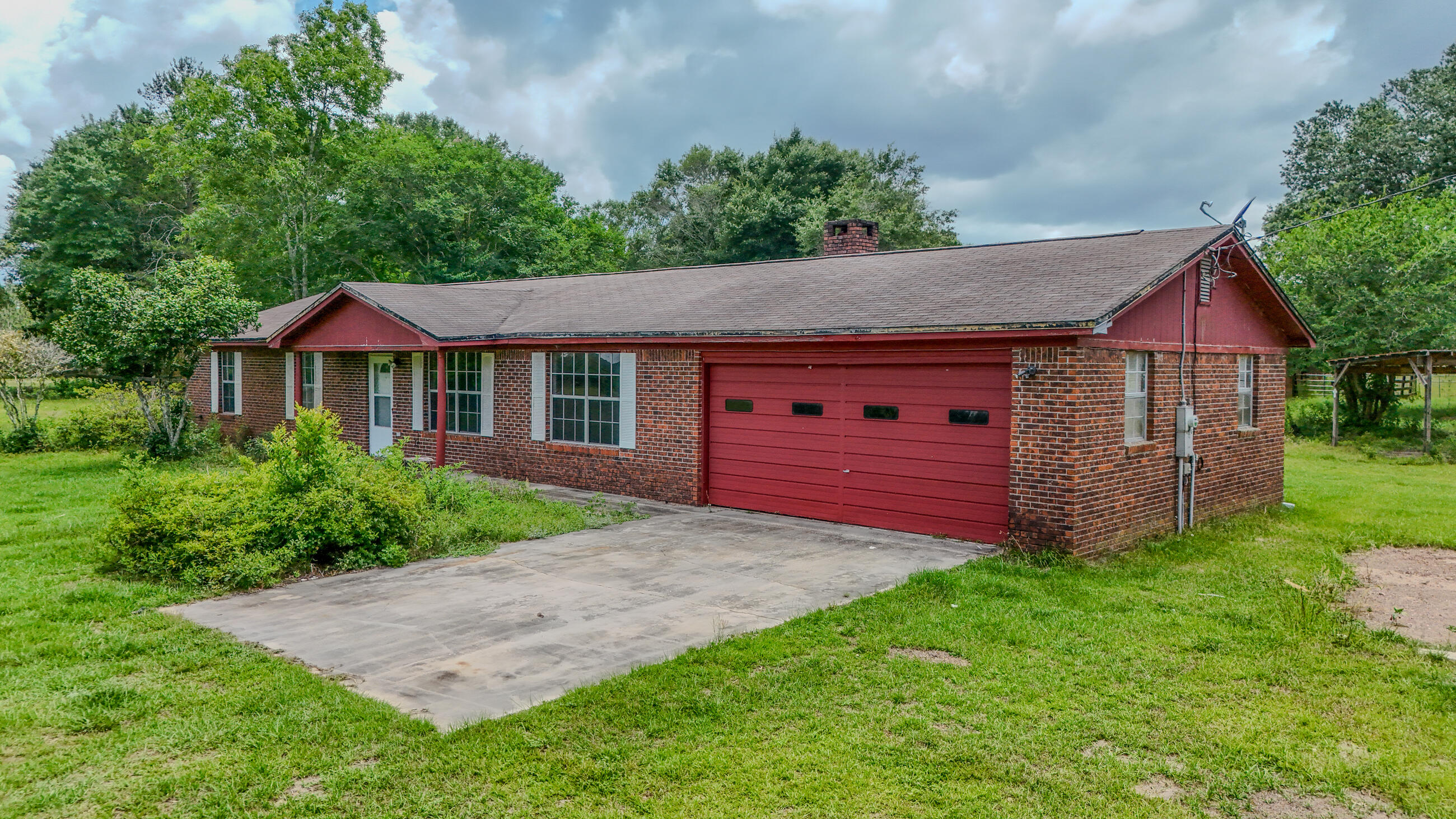 270 Windham Way DeFuniak Springs, FL 32433 - Photo 8 of 51 a aerial view of a house next to a yard and large trees