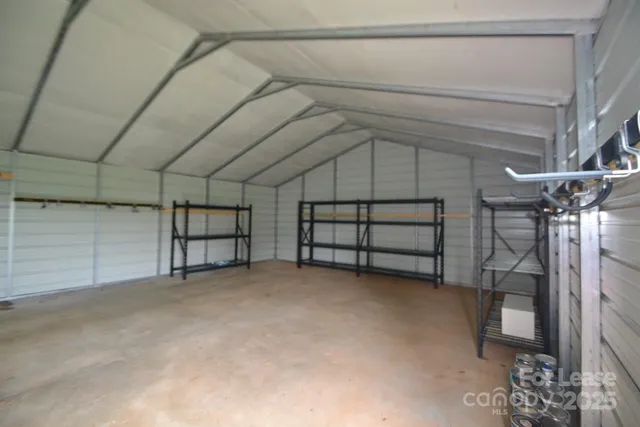 a view of an empty room with a staircase