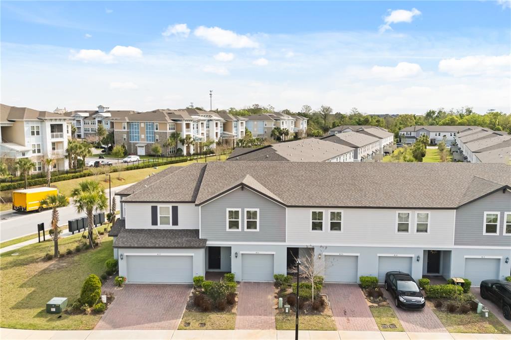 431 Legacy Loop Davenport, FL 33896 - Photo 2 of 25 a aerial view of a house with swimming pool and ocean view