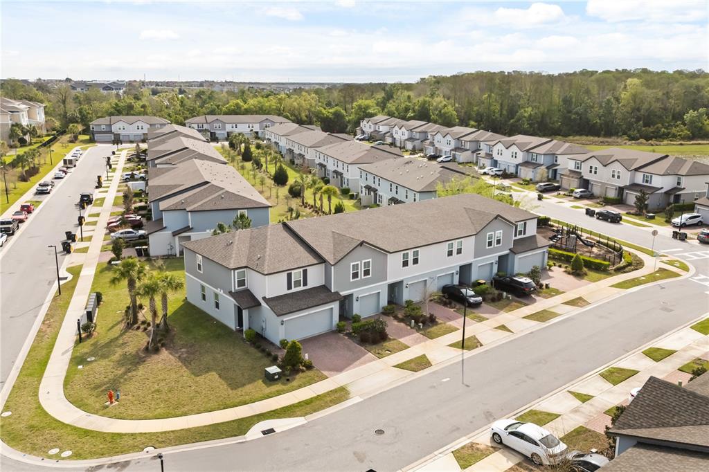 431 Legacy Loop Davenport, FL 33896 - Photo 3 of 25 an aerial view of residential houses with outdoor space