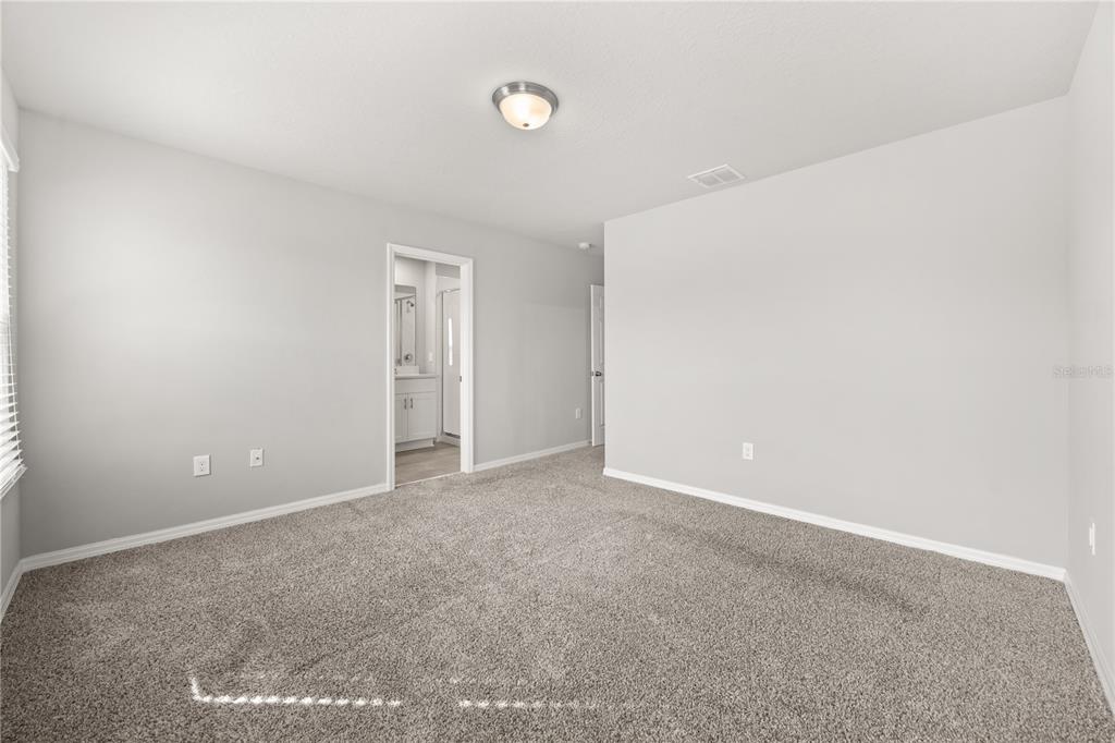 431 Legacy Loop Davenport, FL 33896 - Photo 10 of 25 a view of an empty room