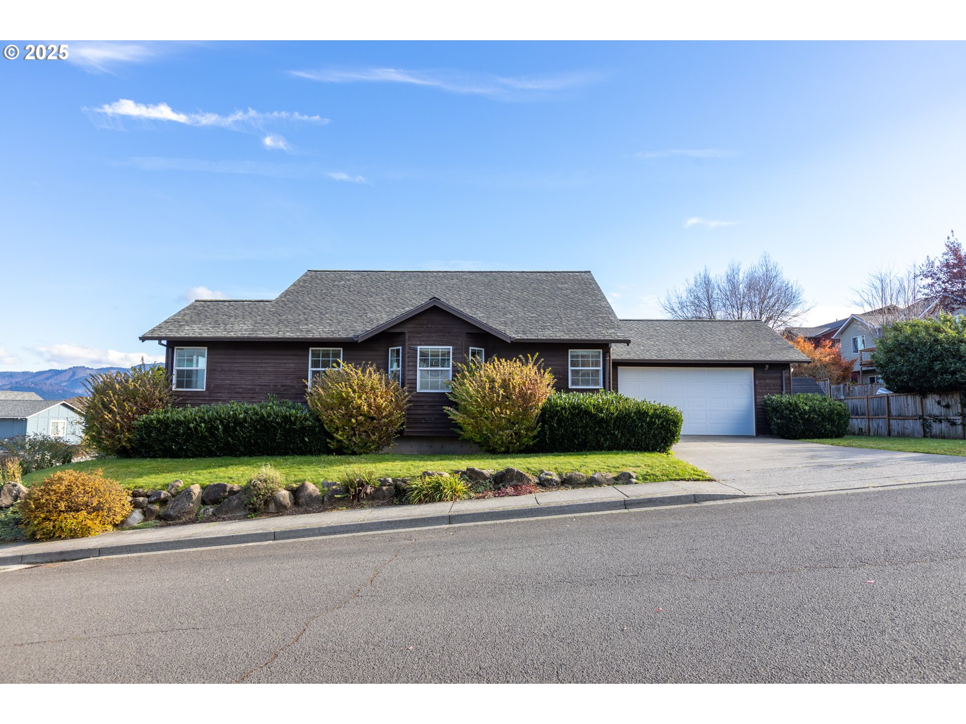 2957 Eugene Street Hood River, OR 97031 - Photo 14 of 42 a front view of a house with a yard