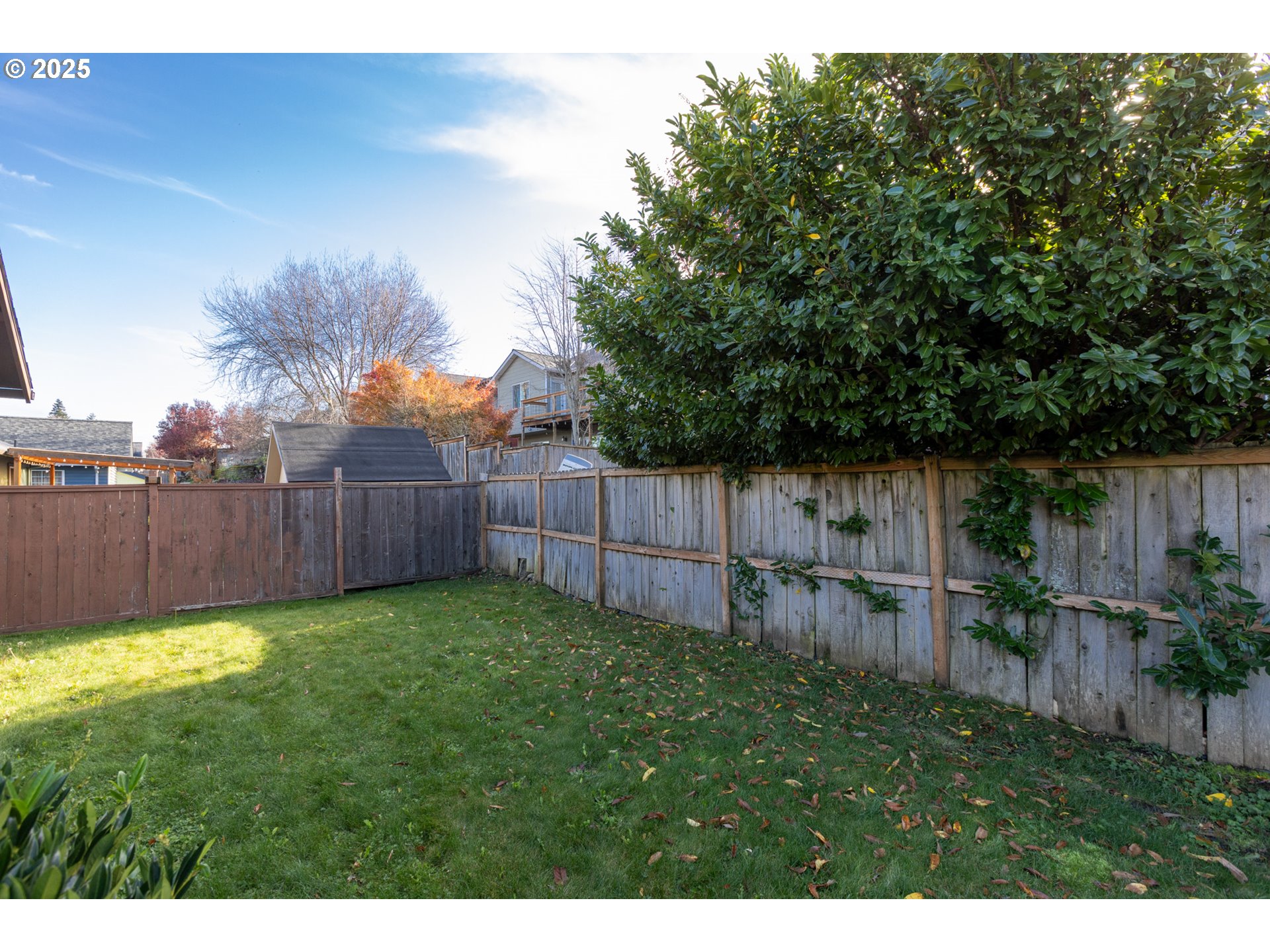 2957 Eugene Street Hood River, OR 97031 - Photo 21 of 42 a view of a backyard with wooden fence