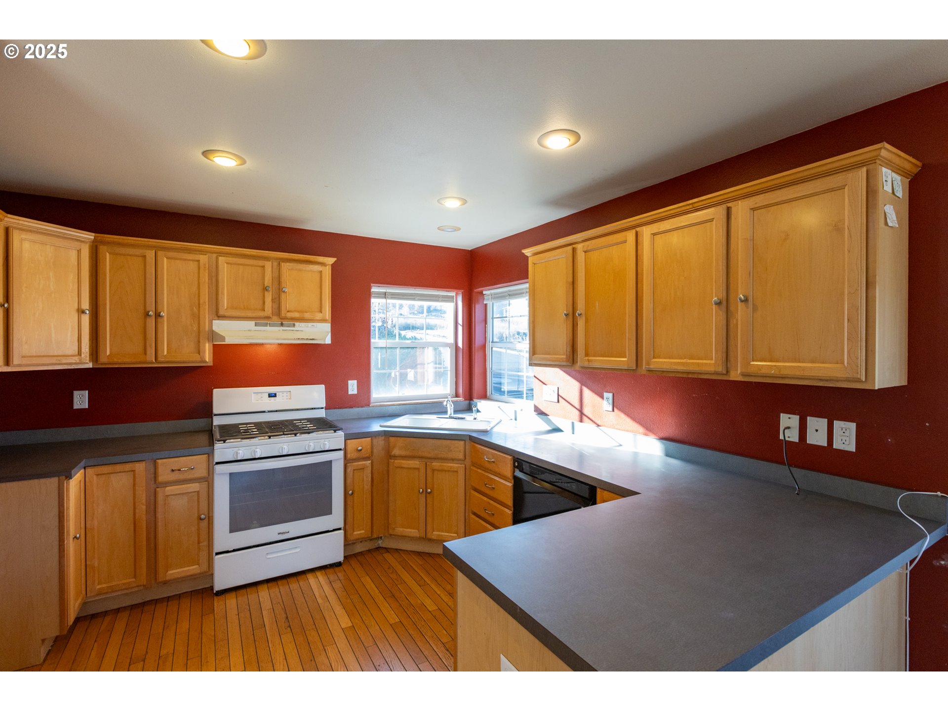 2957 Eugene Street Hood River, OR 97031 - Photo 27 of 42 a kitchen with stainless steel appliances granite countertop a sink a stove counter space and stainless steel appliances