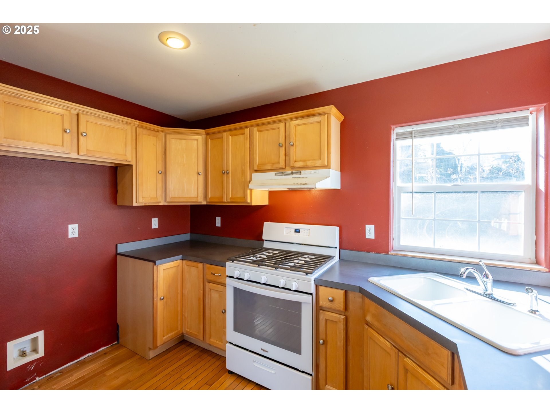 2957 Eugene Street Hood River, OR 97031 - Photo 28 of 42 a kitchen with stainless steel appliances granite countertop a sink stove and granite counter top
