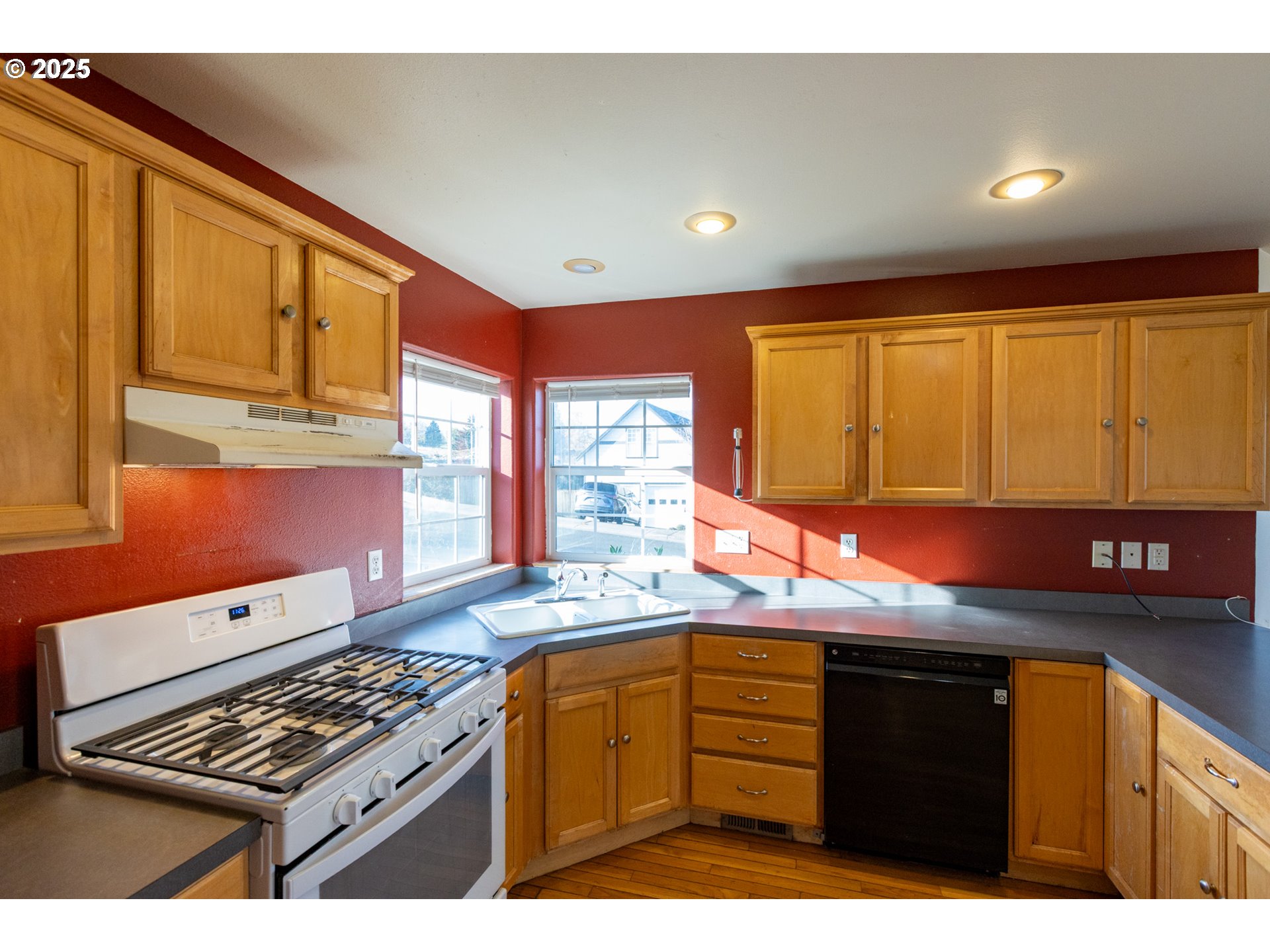 2957 Eugene Street Hood River, OR 97031 - Photo 29 of 42 a kitchen with stainless steel appliances granite countertop a sink stove and cabinets
