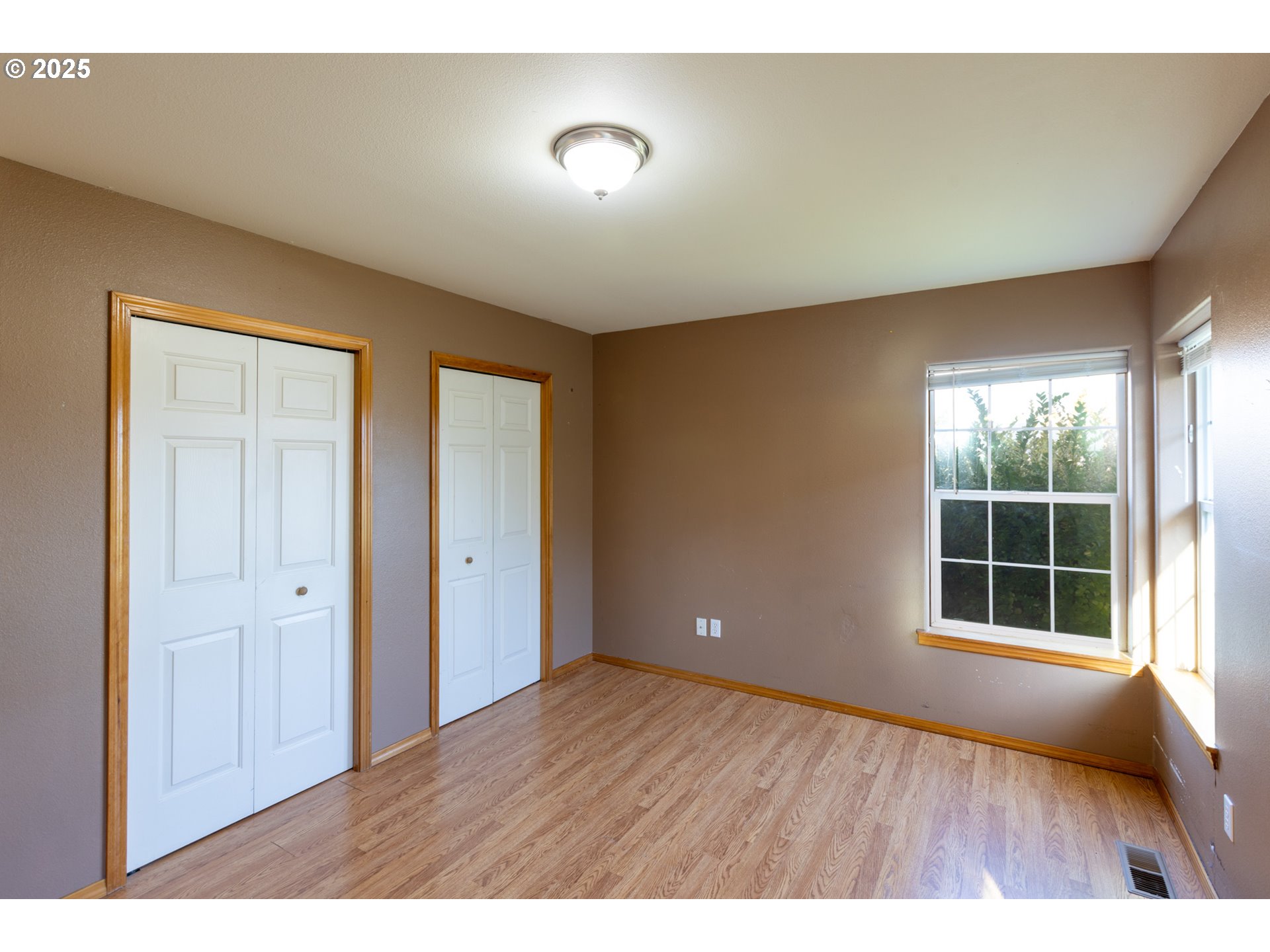 2957 Eugene Street Hood River, OR 97031 - Photo 36 of 42 a view of an empty room with a window and wooden floor