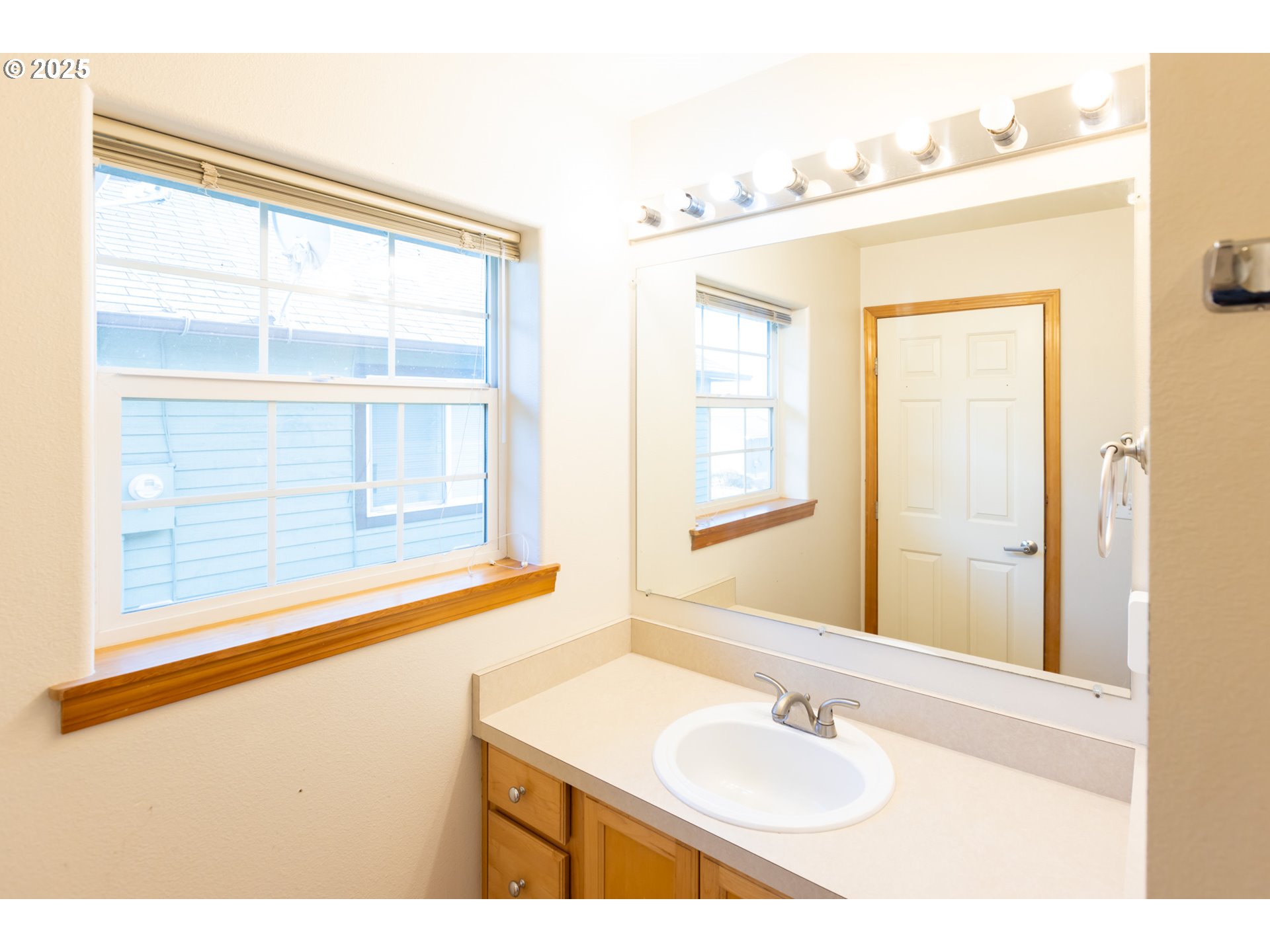 2957 Eugene Street Hood River, OR 97031 - Photo 39 of 42 a bathroom with a sink and a mirror