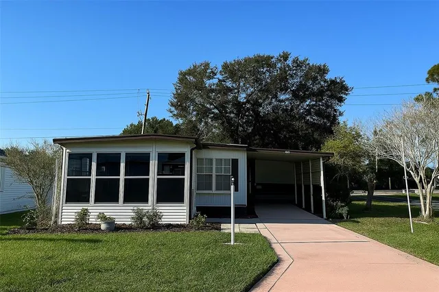 a view of front house with a garden