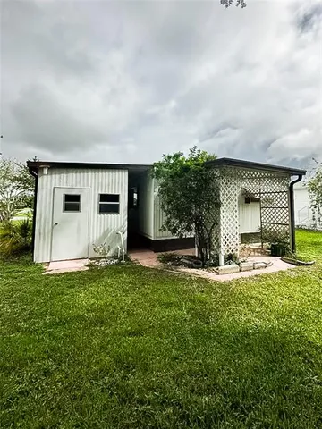 a view of a back yard of the house