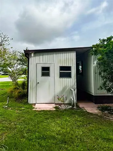 a view of a back yard of the house