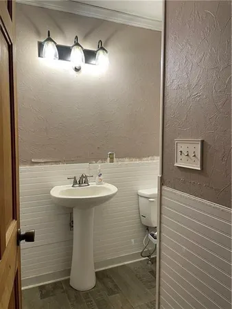 a view of a livingroom with furniture fire place and an entrance