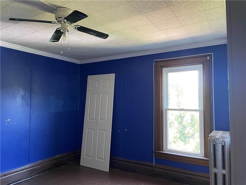 9 Gratz Street Penn, PA 15675 - Photo 20 of 34 a room with windows and a ceiling fan