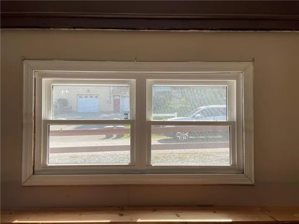 a view of a backyard with pathway