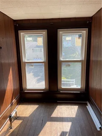 a view of a balcony with wooden floor