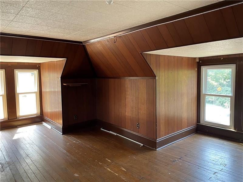 9 Gratz Street Penn, PA 15675 - Photo 29 of 34 an empty room with wooden floor and windows