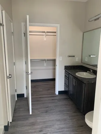 a kitchen with a refrigerator and a stove
