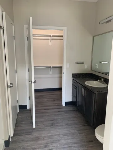 a kitchen with a refrigerator and a stove