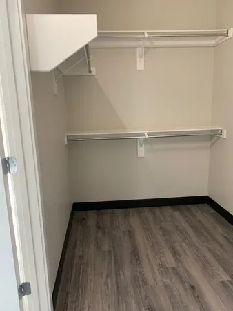 a view of an empty walk in closet
