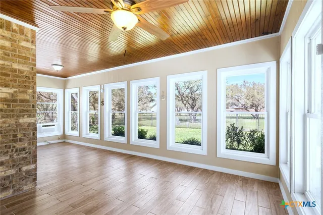 a view of an entryway with wooden floor