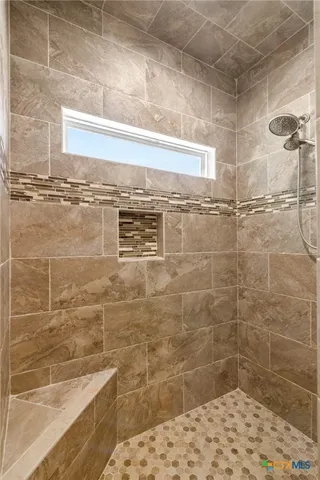 a bathroom with a sink vanity granite and toilet