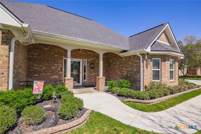 a view of a house with a small yard