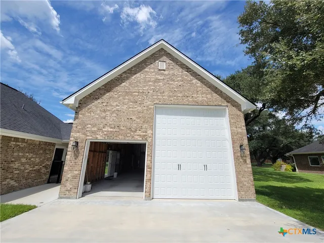 a view of an empty room with windows