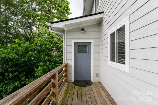 a view of balcony with wooden floor and fence