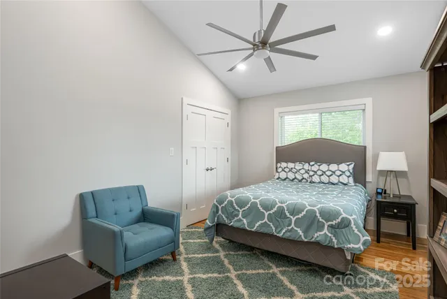 a bedroom with a bed a couch and a couch