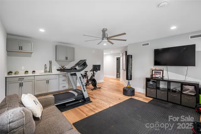 a view of a livingroom with furniture and a flat screen tv