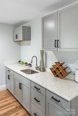 a kitchen with sink and stove