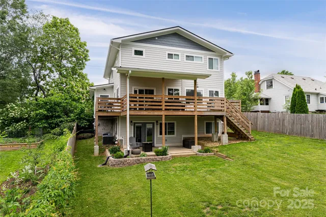 a view of a house with swimming pool and porch