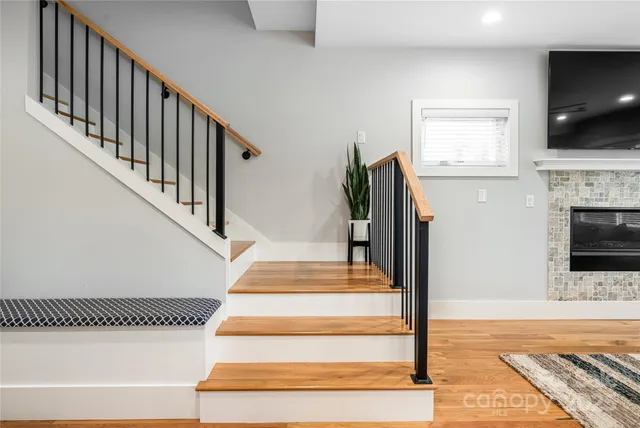 a view of entryway and hall with wooden floor