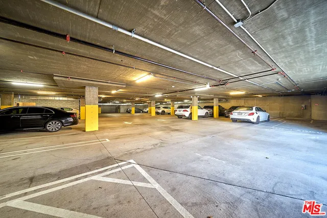 a view of parking garage with cars