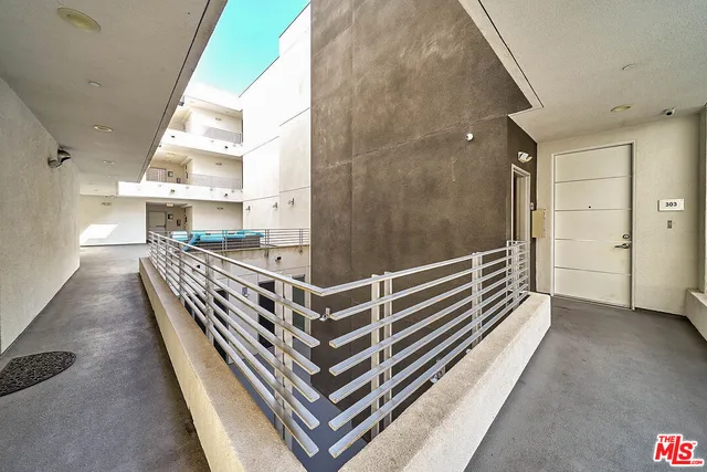 a view of a balcony with chairs