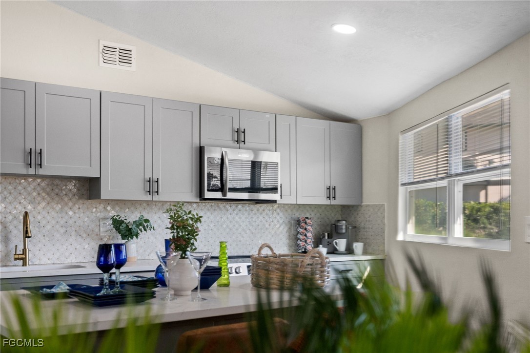 190 Tarpon Road Fort Myers Beach, FL 33931 - Photo 14 of 47 a kitchen with kitchen island granite countertop lots of counter top space