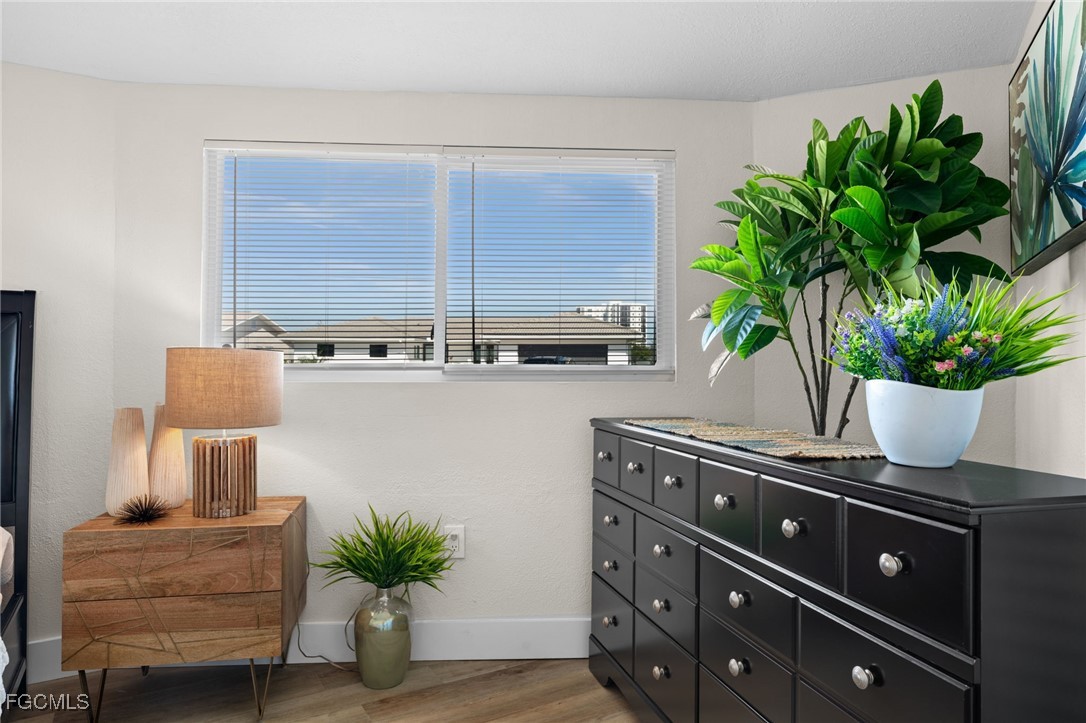190 Tarpon Road Fort Myers Beach, FL 33931 - Photo 19 of 47 a kitchen with a potted plant on the counter and a potted plant