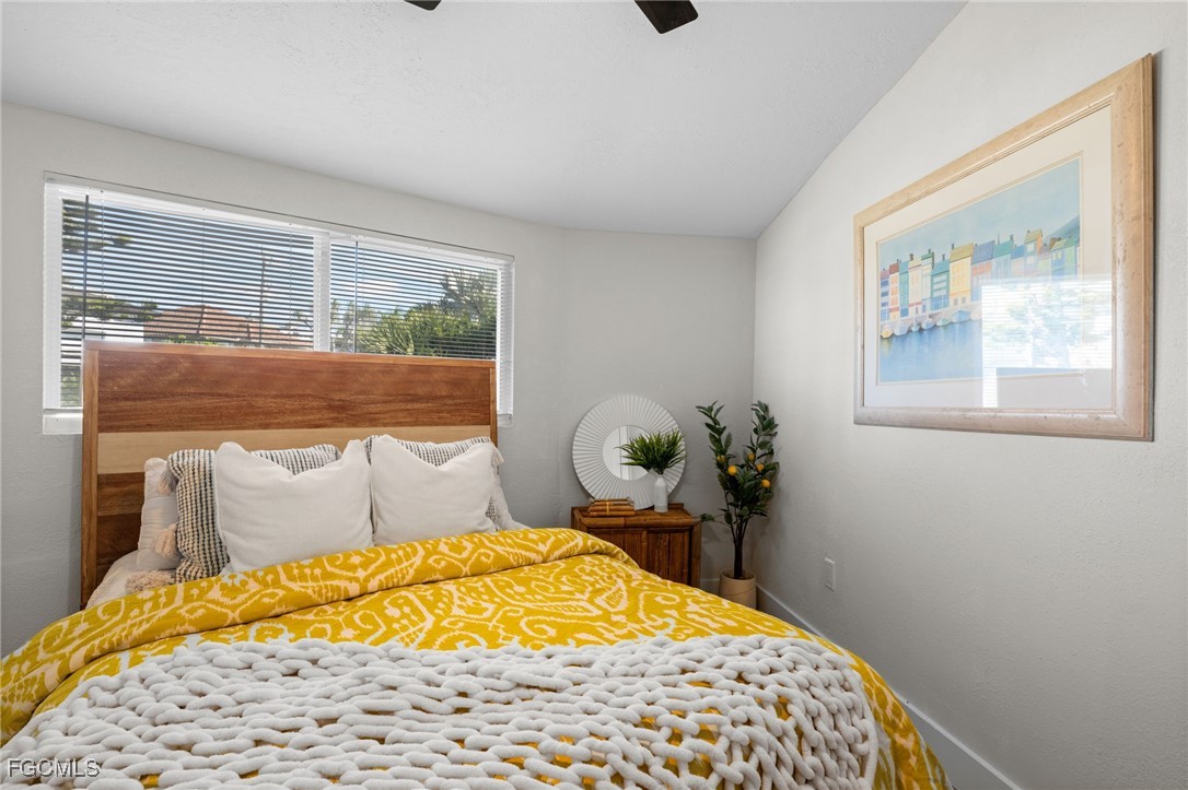 190 Tarpon Road Fort Myers Beach, FL 33931 - Photo 21 of 47 a bedroom with a bed and a window