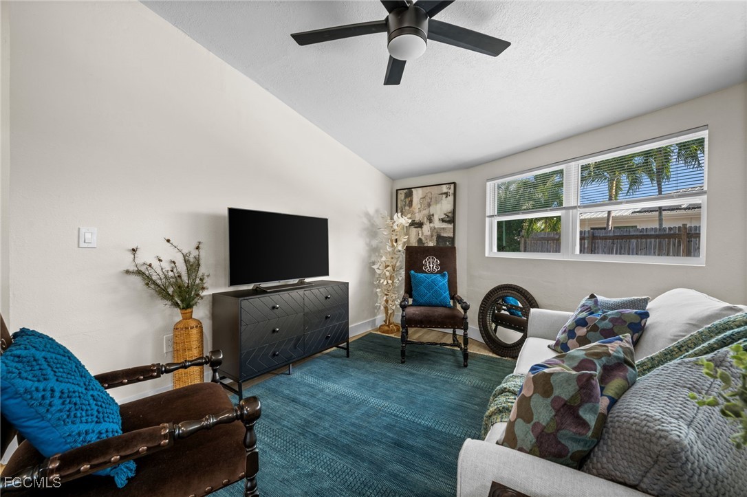 190 Tarpon Road Fort Myers Beach, FL 33931 - Photo 3 of 47 a living room with furniture and a flat screen tv