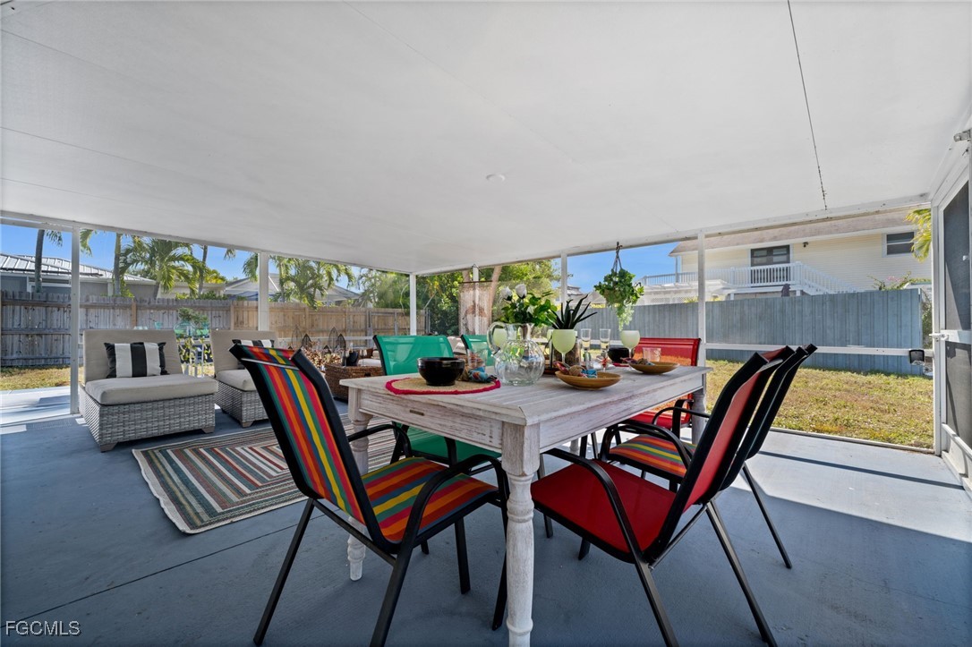 190 Tarpon Road Fort Myers Beach, FL 33931 - Photo 45 of 47 a dining room with furniture and a window