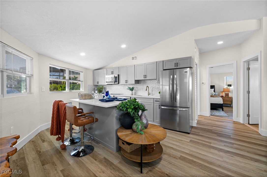190 Tarpon Road Fort Myers Beach, FL 33931 - Photo 9 of 47 a living room with furniture and a refrigerator