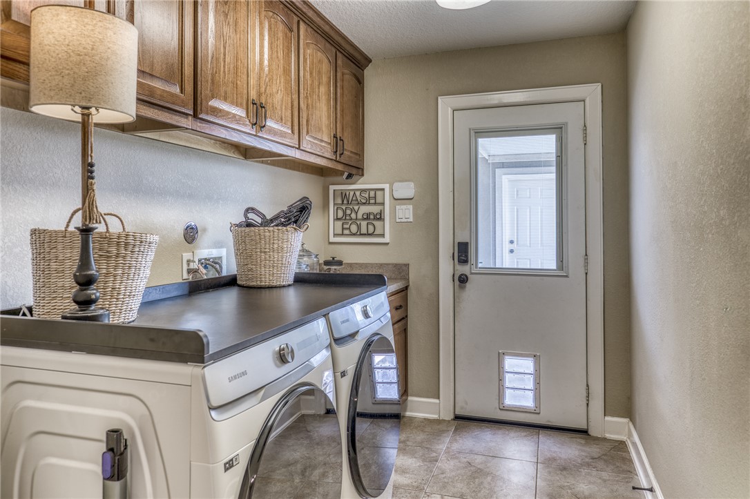 586 Ruby Drive Bellville, TX 77418 - Photo 29 of 50 a kitchen with stainless steel appliances granite countertop a sink a stove and cabinets