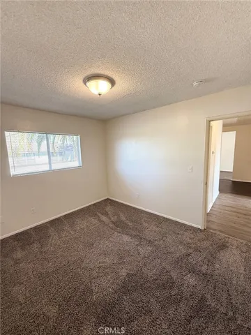 an empty room with a empty space and windows