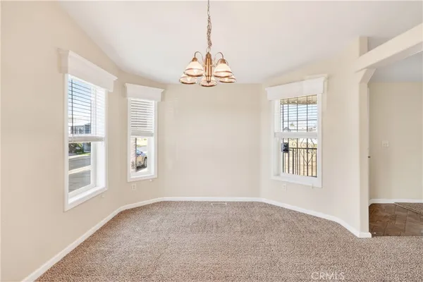 a en suite bathroom with a granite countertop sink and a mirror