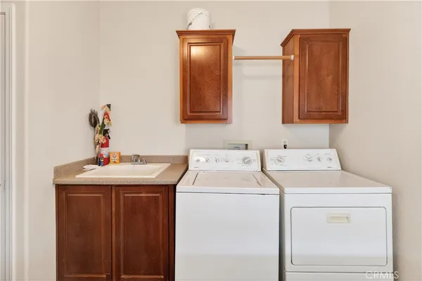 a bathroom with a bathtub shower sink vanity and toilet