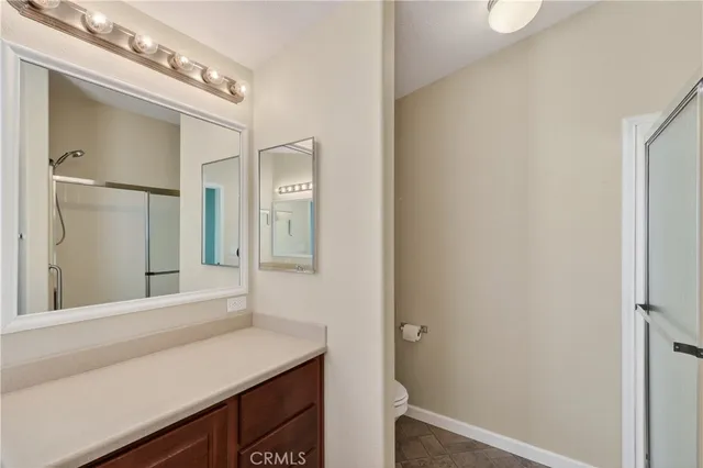 a view of a patio with table and chairs and potted plants