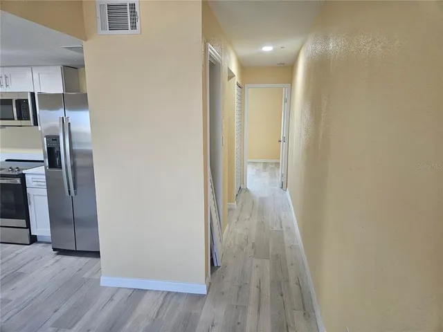 a view of a livingroom with wooden floor